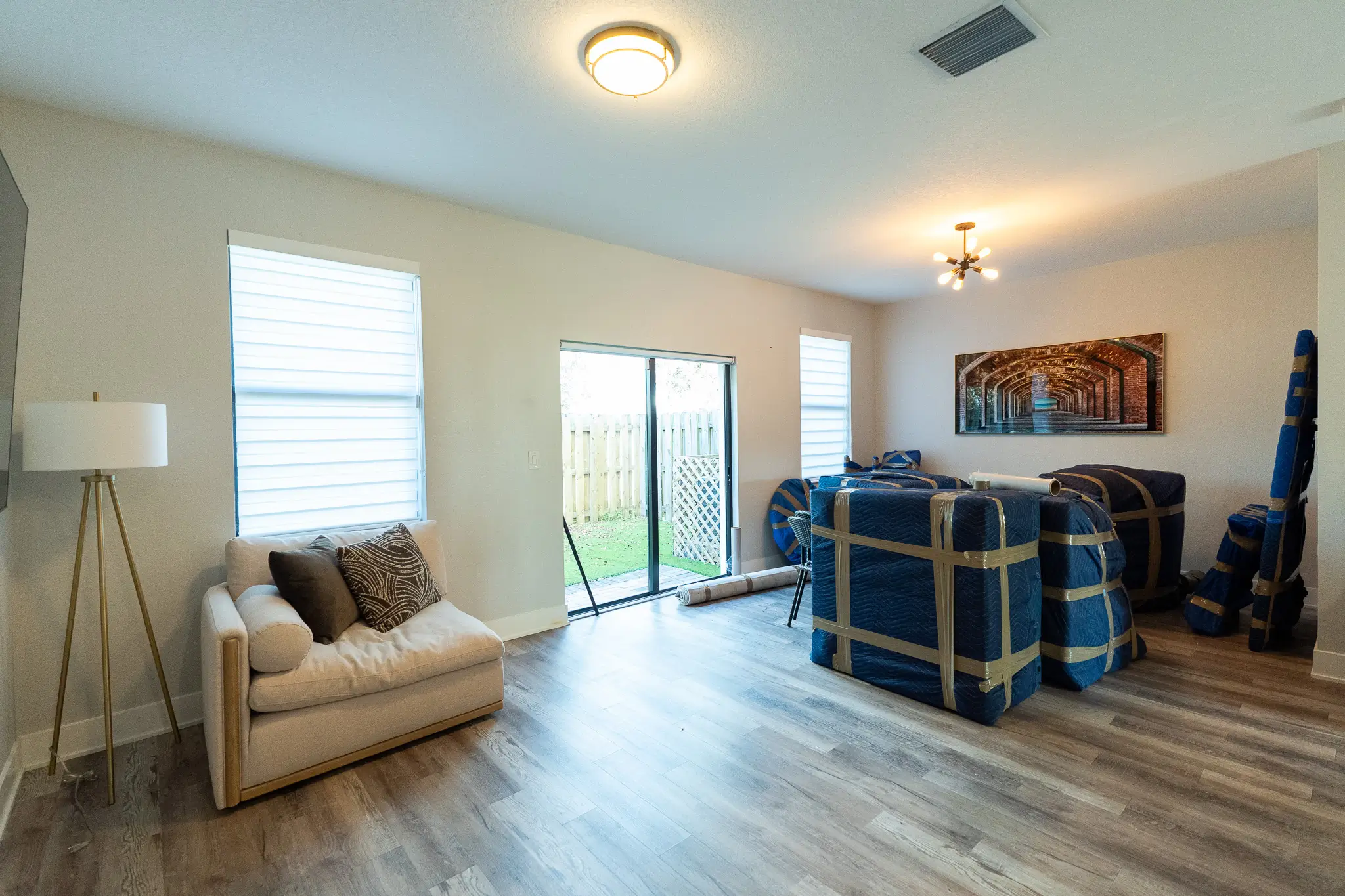 Household furniture professionally wrapped and staged room by room before loading